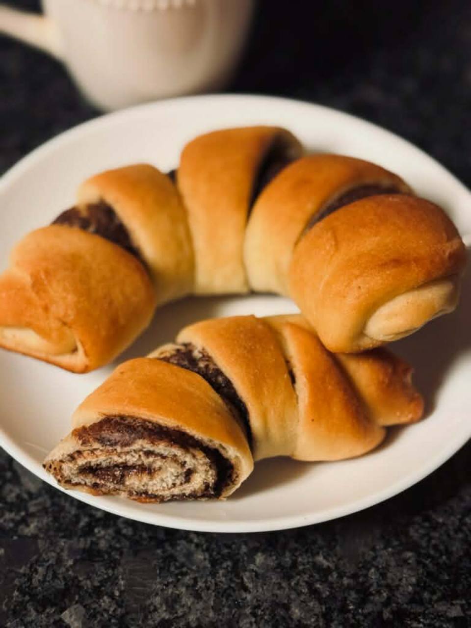 Chocolate hazelnut claw pastries on a plate